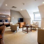 A stylish guest room with countryside views